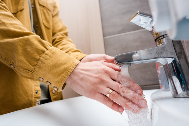 cropped view of woman washing hands at home - Фото, зображення