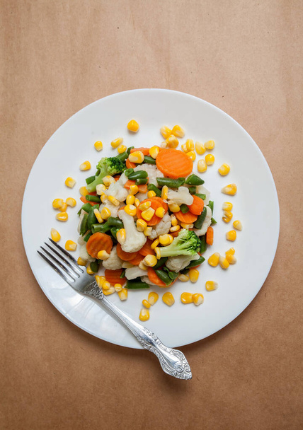steamed vegetables on plate - Fotó, kép