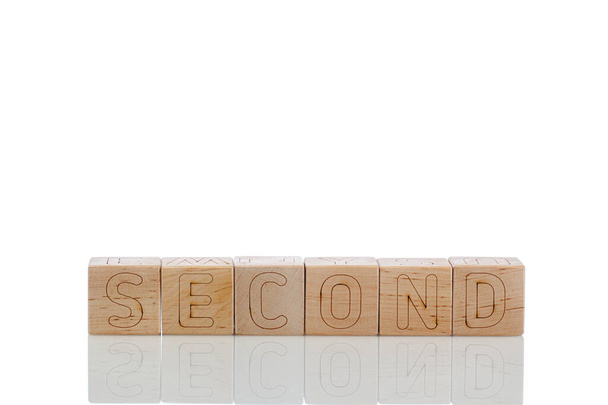 木製の立方体白い背景に文字の2番目のクローズアップ - 写真・画像