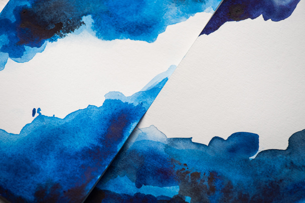 High angle view of paper with japanese painting with blue watercolor - Fotó, kép