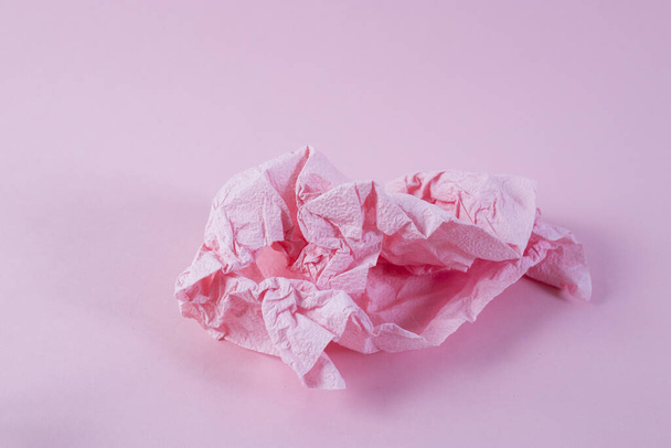 Crumpled pink napkin on pink background. Copy space - Fotografie, Obrázek
