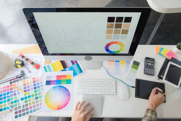 Engineers and creative artists work on table, work, consult, advise on choosing colors and materials, measuring size, choosing cool colors, soft tones, beautiful tones. - Photo, Image