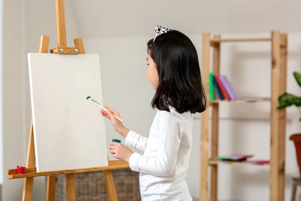 Cute little artist painting at home - Foto, Imagen