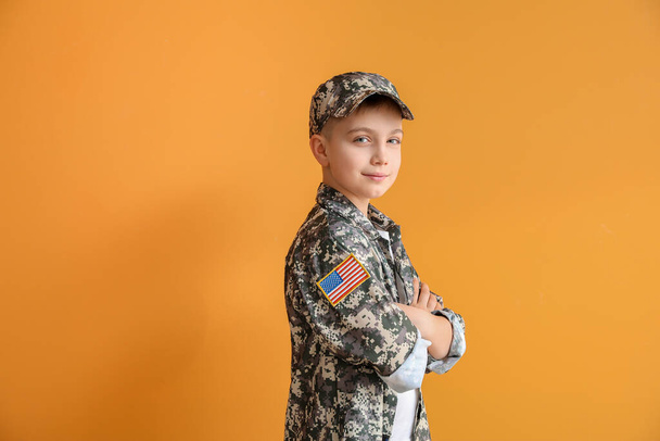 Cute little soldier on color background - Foto, Imagen