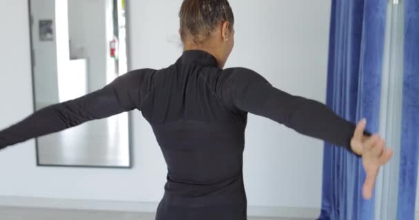 Young attractive woman dancing in studio - Felvétel, videó