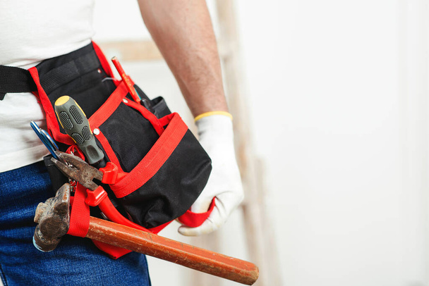 Tool belt with construction tools. Handyman with tools. Copy space. Builder handyman with construction tools. Handyman tool belt, closeup. House renovation service. - Photo, Image