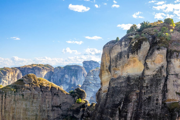 Greece. Summer sunny day in Meteora. Sheer cliffs and blue sky with clouds - Фото, зображення