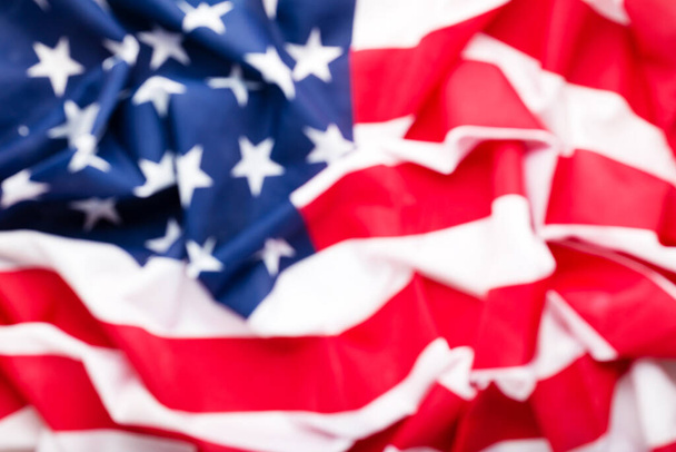 USA flag background blurred for design. American national flag as symbol of democracy, patriot, US Memorial Day or 4th of July. Closeup texture Flag of the United States of America or U.S. flag. - Foto, Imagen