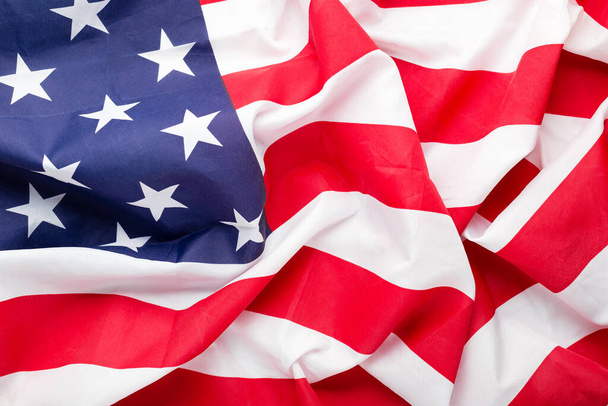 アメリカの国旗の背景。民主主義、愛国者、 7月4日を象徴するアメリカ国旗。閉鎖のテクスチャ米国または米国の国旗. - 写真・画像
