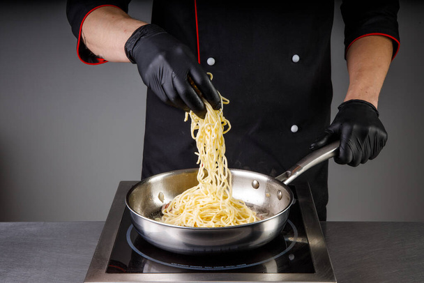 restaurant chef cooking noodles for website and menu3 - Фото, изображение