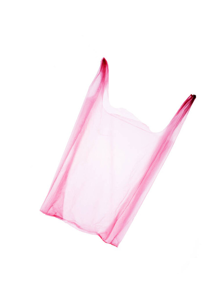 Das rosa Polyethylen-Paket isoliert auf weißem Hintergrund. Das Problem des Sonnenbrandes hat den Planeten fest im Griff. - Foto, Bild