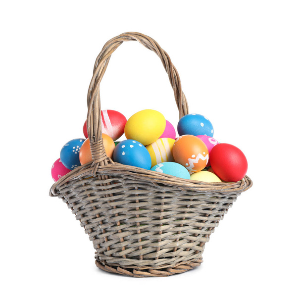 Basket with colorful Easter eggs isolated on white - Photo, image
