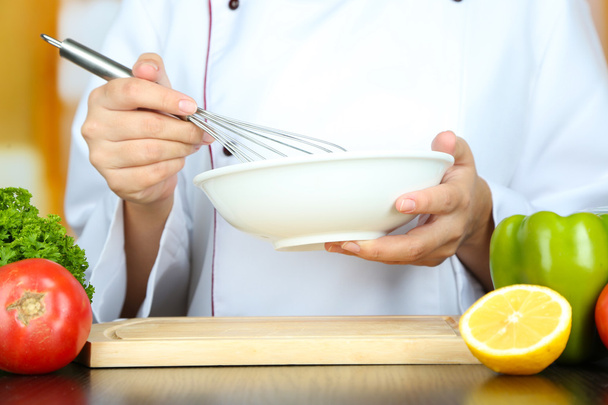 Cook hands whisking mayonnaise - Foto, afbeelding