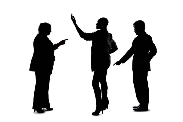 Silhouette of a group of people pointing.  The crowd is isolated on a white background and the models are unrecognizable and anonymous.  - Photo, Image