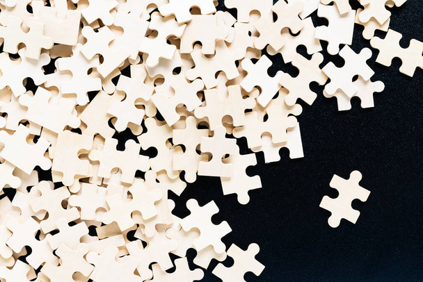Top view Shot of wooden jigsaw puzzle pieces ,Business concept - Photo, Image
