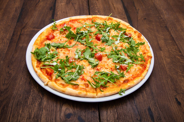 classic Italian pizza on a wooden table - Photo, image