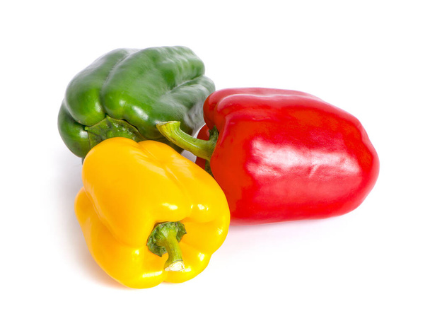green , yellow and red bell peppers on white background - Fotó, kép
