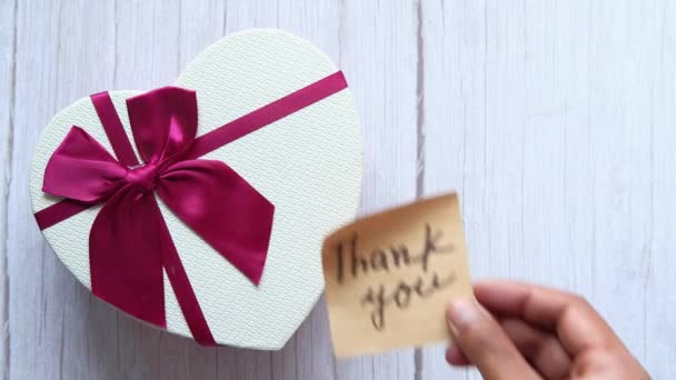top view of thank message on heart shape gift box  - Felvétel, videó