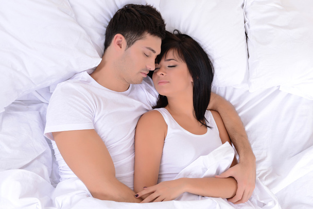 Couple in love sleeping in bed - Photo, image