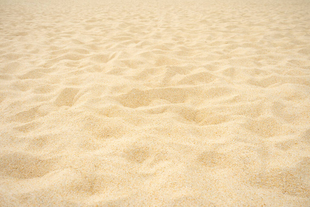Volledige frame van strand zand textuur als achtergrond - Foto, afbeelding