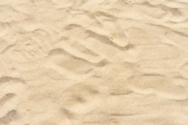 strand zand achtergrond in de zomer zon - Foto, afbeelding