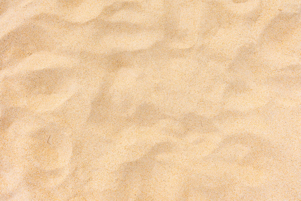 背景と質感、背景として夏の太陽の下でのビーチの砂のテクスチャの近くのuo. - 写真・画像