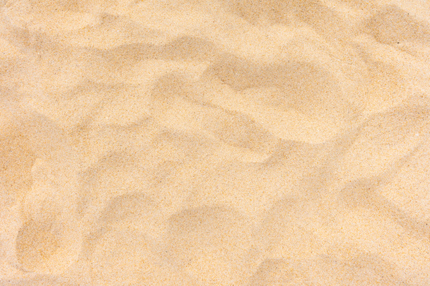 Natuur strand zand textuur in de zomer zon - Foto, afbeelding
