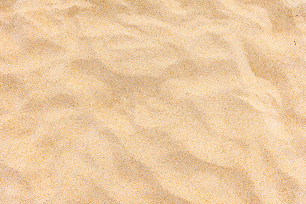 Background and texture, Close-uo of beach sand texture in summer sun as background. - Photo, Image