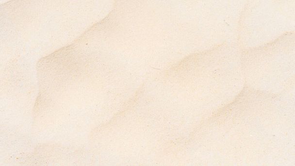 Фон и текстура, вид сверху на пляжную песочную природу под летним солнцем в качестве фона
 - Фото, изображение