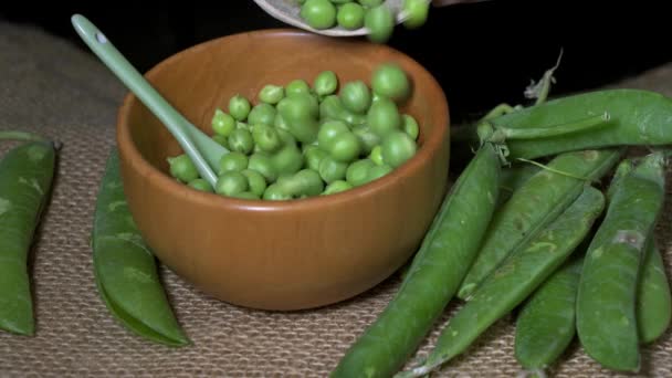 shelled peas in a wooden bowl.  - Footage, Video