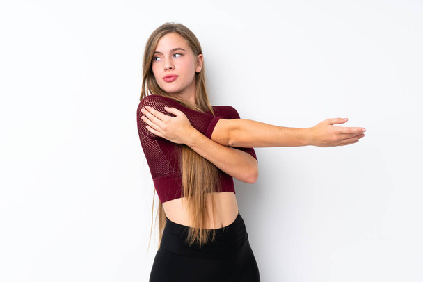 Sport adolescent fille sur fond blanc isolé étirement bras
 - Photo, image