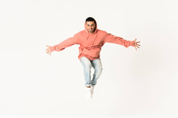Man dancing street dance style over isolated white background - Fotografie, Obrázek