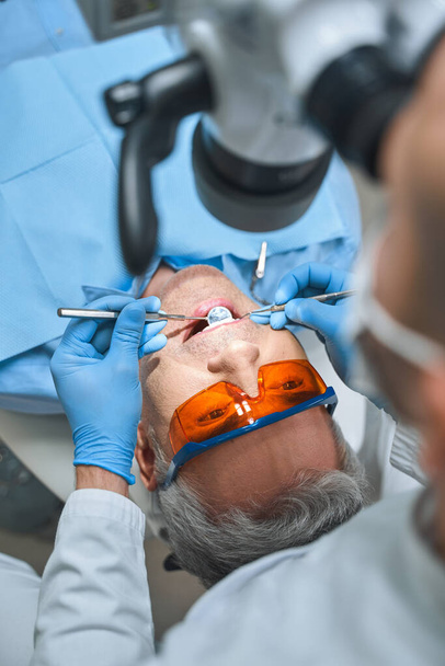 Man during visit to dentist stock photo - Photo, image