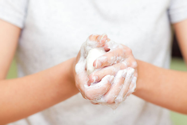 Front view on girls hands with soap foam, personal hygiene concept - Valokuva, kuva