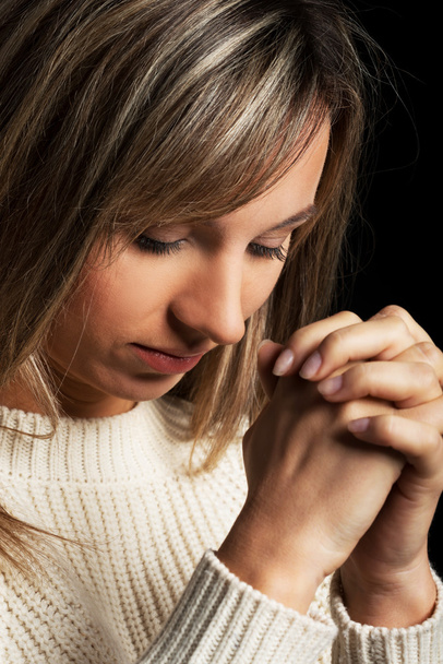 Casual young woman praying. - Zdjęcie, obraz