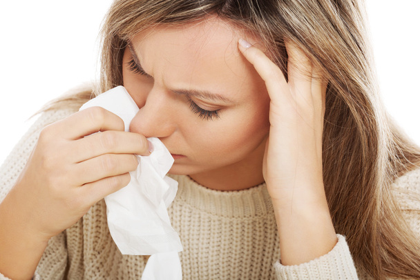 Young woman with tissues crying or having runny nose. - Fotoğraf, Görsel