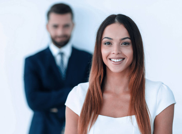 portrait of a business woman while the man is in the background - Photo, Image
