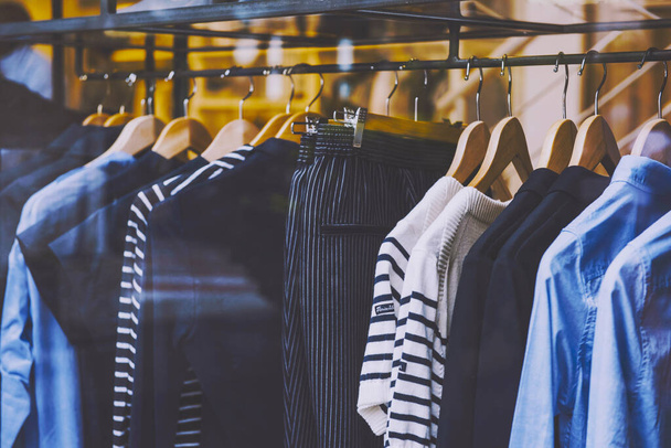 clothes on a rack in a store - Photo, Image