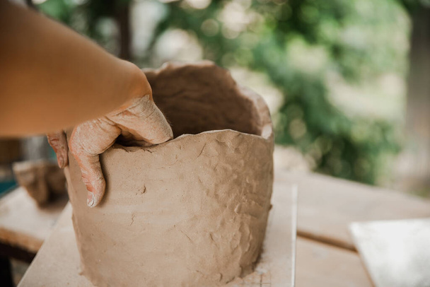 Handmade clay brown pots with blurry background - Foto, immagini