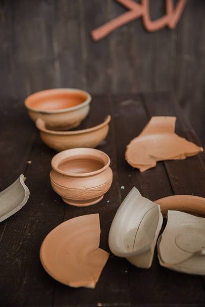 Handmade clay brown pots with blurry background - 写真・画像