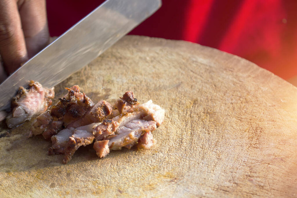 Thin sliced grilled meat on the wood cutting board. Foods that are vulnerable to cancer - Fotografie, Obrázek
