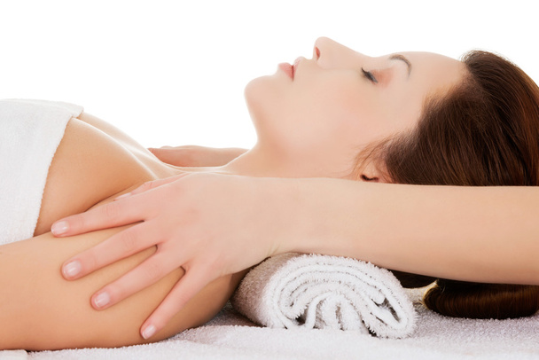 Beautiful young relaxed woman enjoy receiving face massage - Foto, Bild