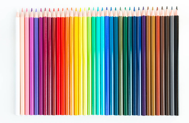 Crayons and watercolor pastels lined up isolated on white background - Фото, зображення