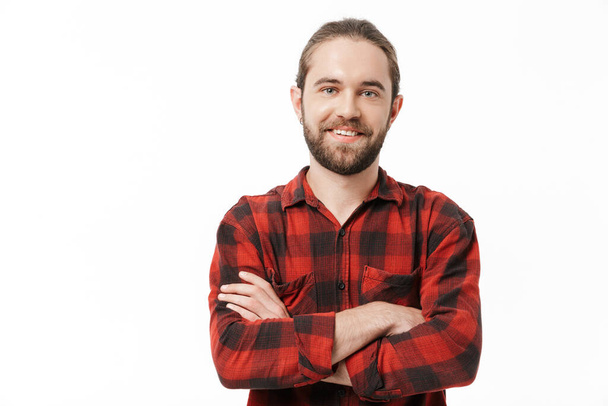 Image of a happy young handsome bearded man posing isolated over white wall background. - Φωτογραφία, εικόνα