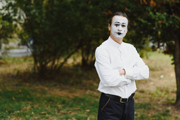 Portrait of a man, artist,clown, MIME. Shows something. Mime actor shows different emotions. - 写真・画像