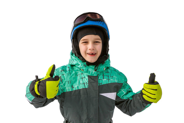 little boy on mountains in ski helmet with fallen first tooth - Foto, Bild