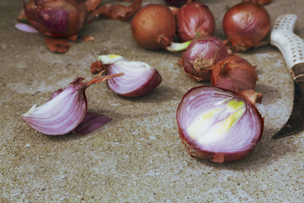 number of organic, homegrown onions on cement floor - Photo, Image