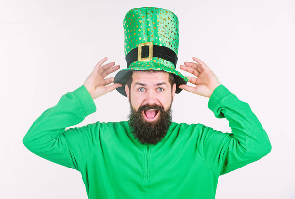 Global celebration of irish culture. Saint patricks day holiday. Green color part of celebration. Myth of leprechaun. Happy patricks day. Man bearded hipster wear green clothing and hat patricks day - Фото, зображення
