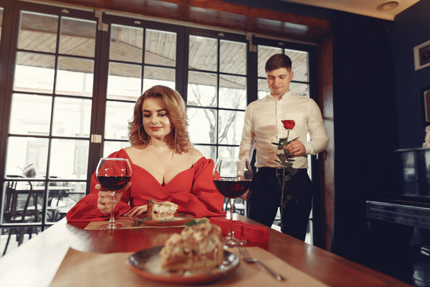 Elegant couple spend time in a restaurant - 写真・画像