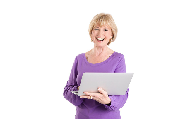 Mature woman using laptop - Foto, Imagen